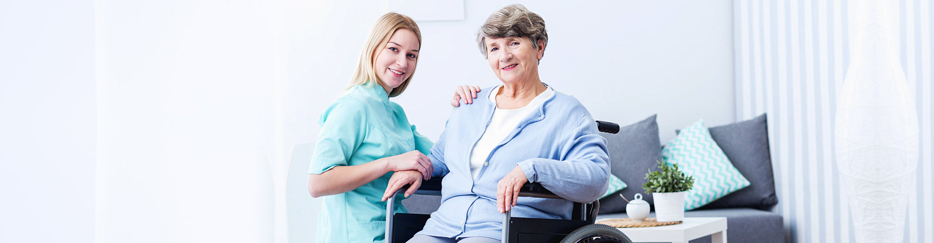 an elderly on a wheelchair smiling